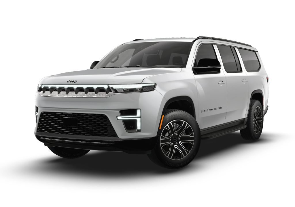 A white Jeep Grand Wagoneer SUV is shown from a front-side angle, featuring sleek LED headlights, a bold grille, black roof rails, and large black alloy wheels.